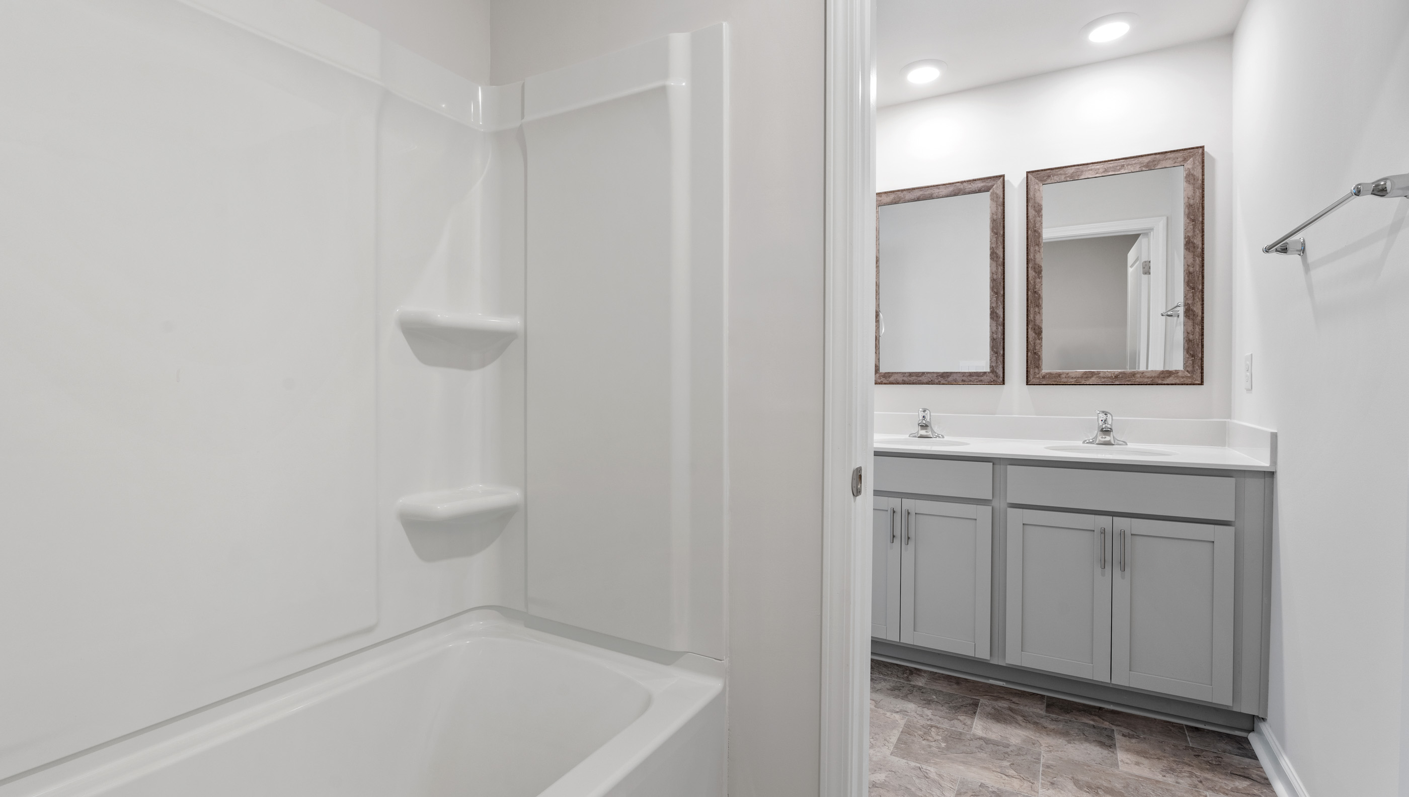 Bathroom with vanity and showertub.