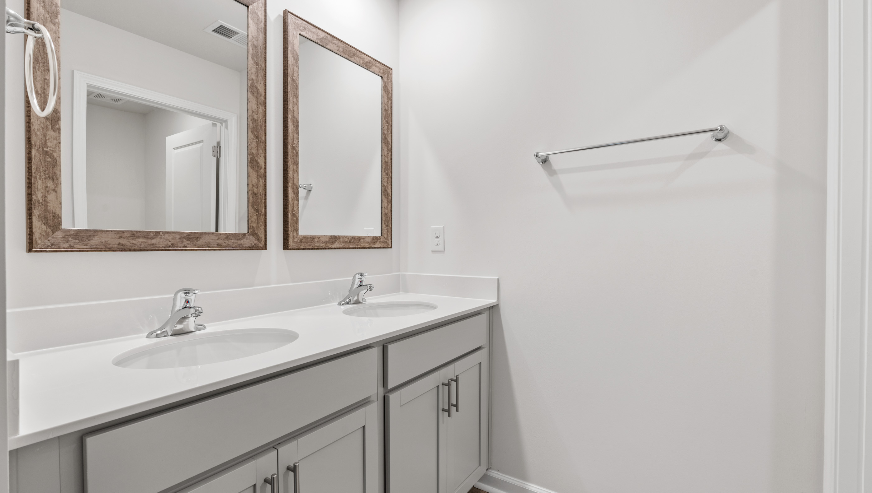 Bathroom with vanity and shower.