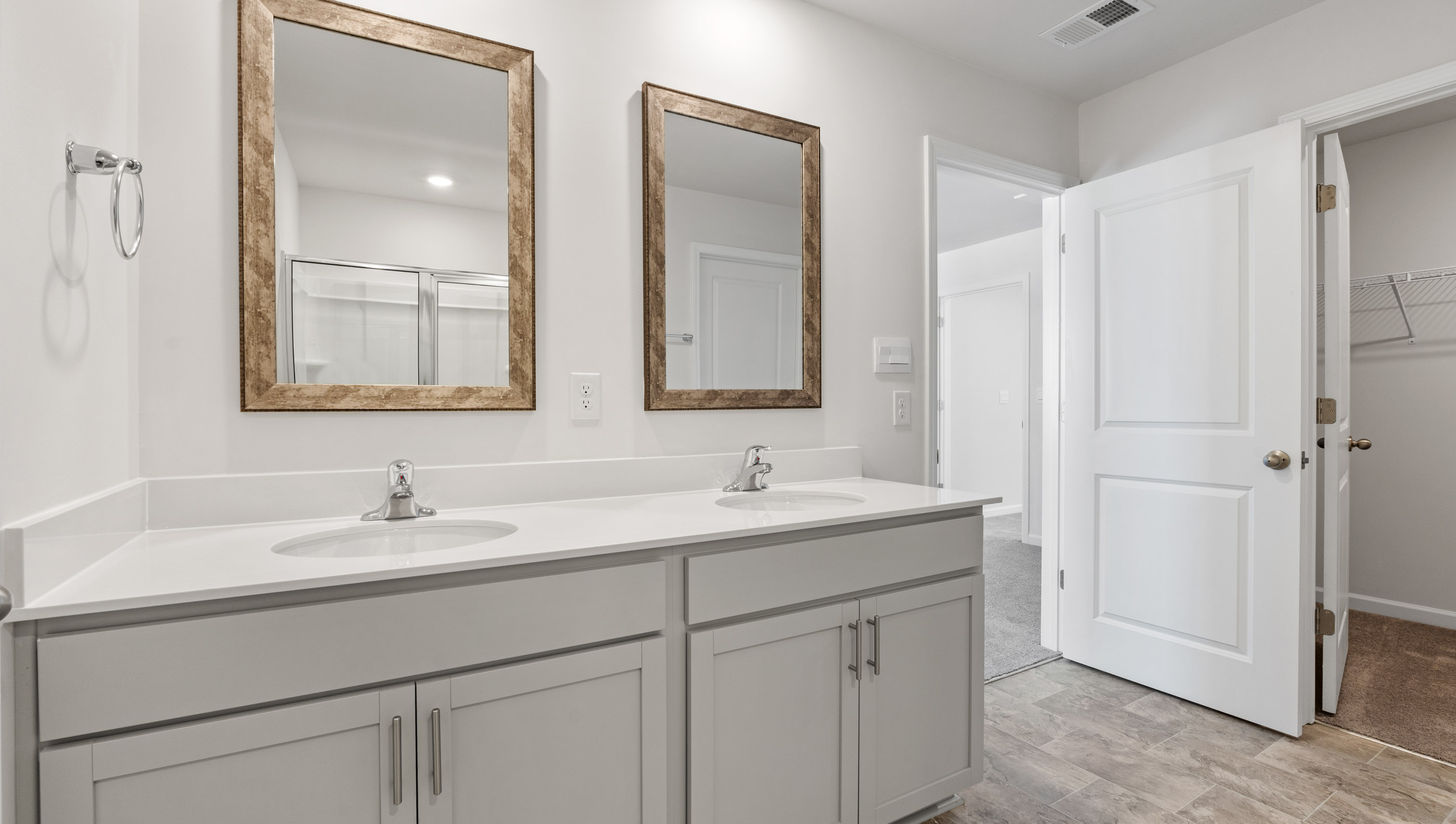Bathroom with vanity and shower.