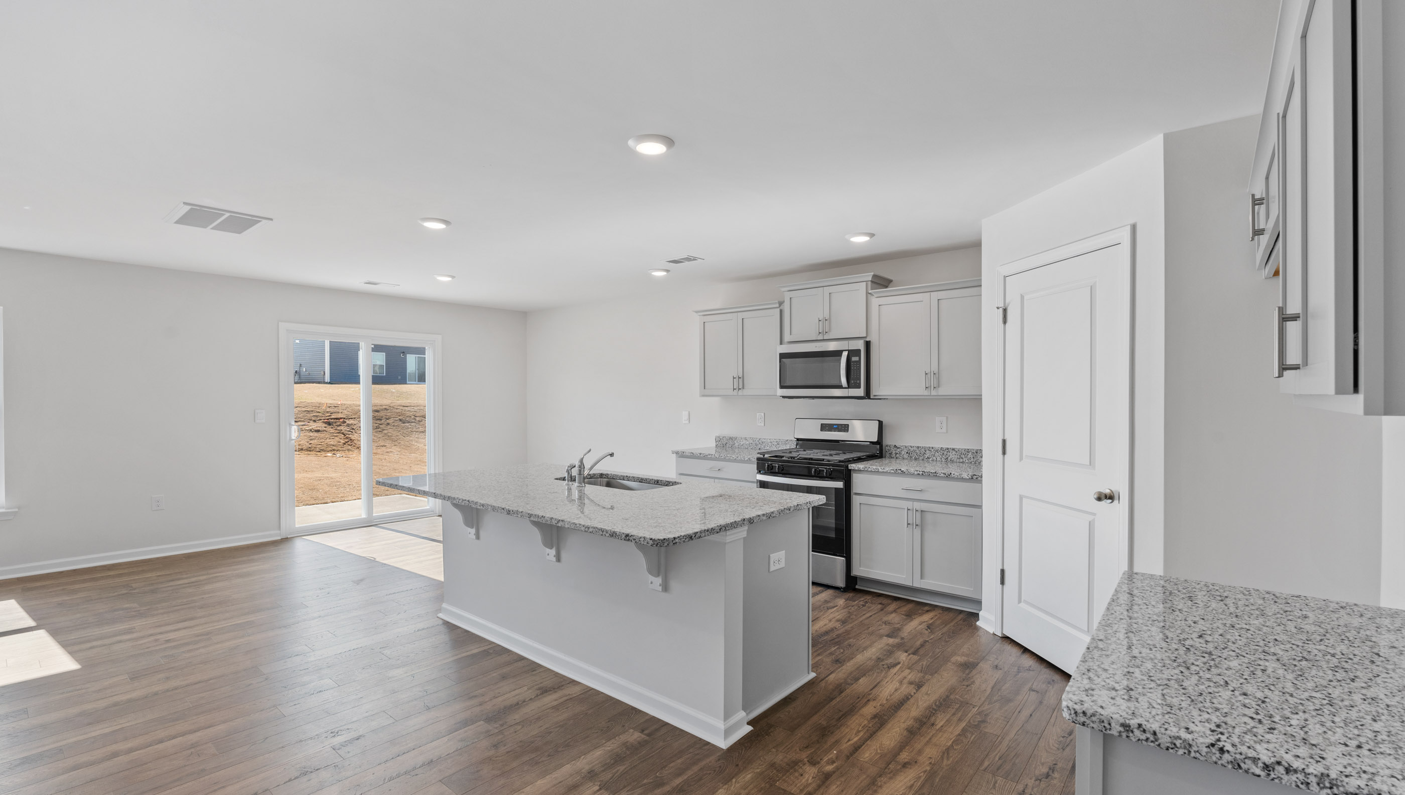Kitchen with island and countertops.
