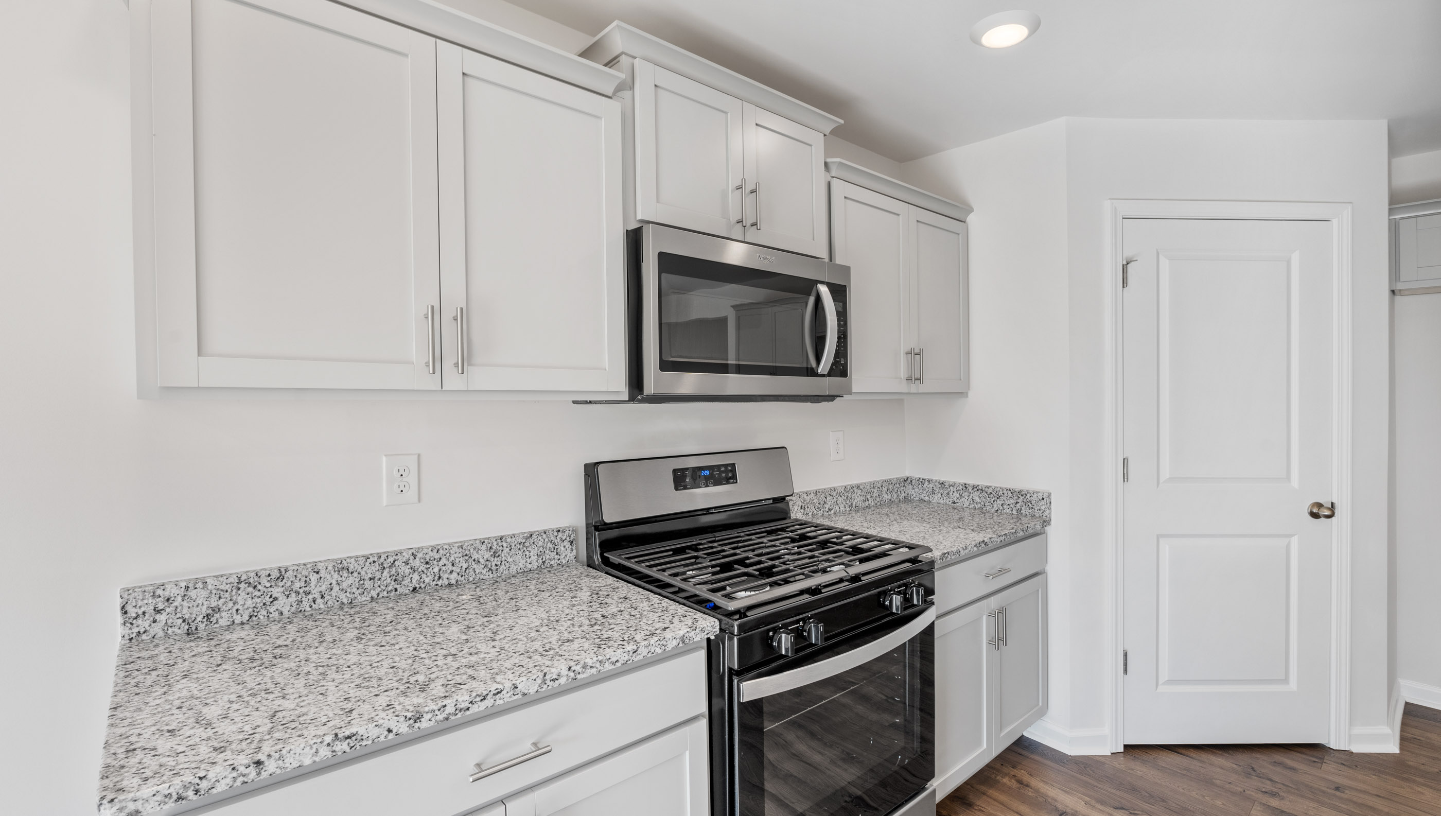 Kitchen with island and countertops.