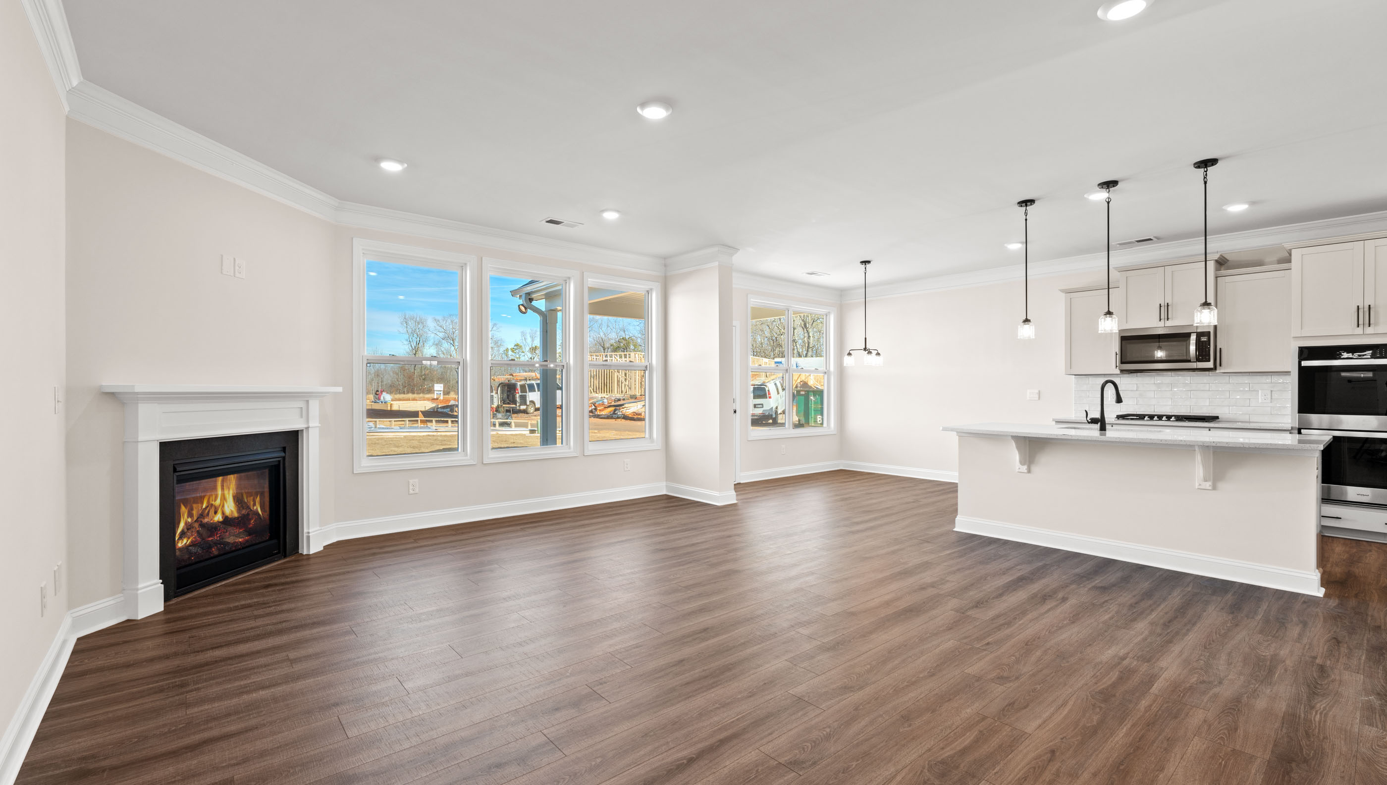 Living area with windows and fireplace.