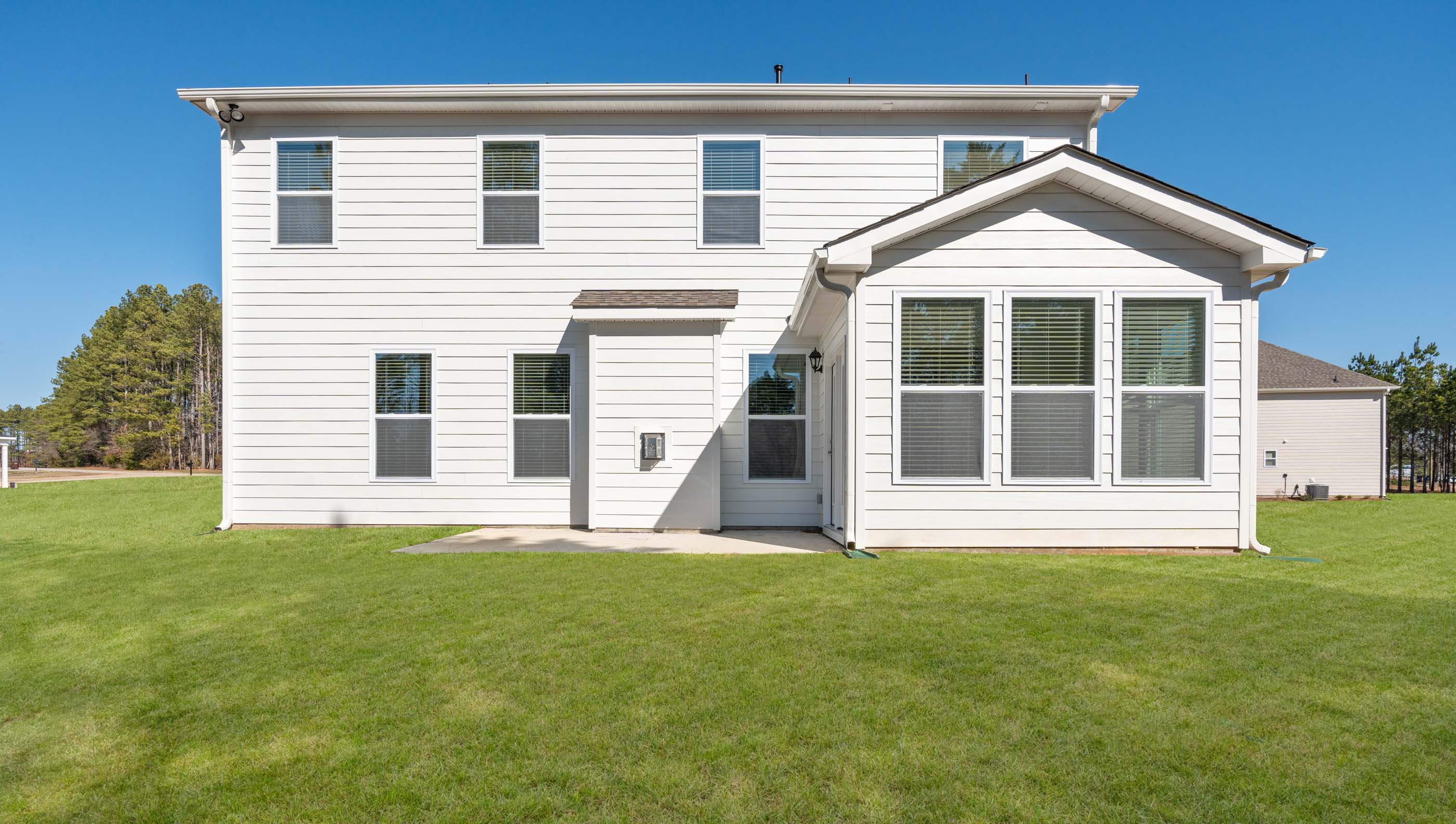 Back exterior with large backyard.
