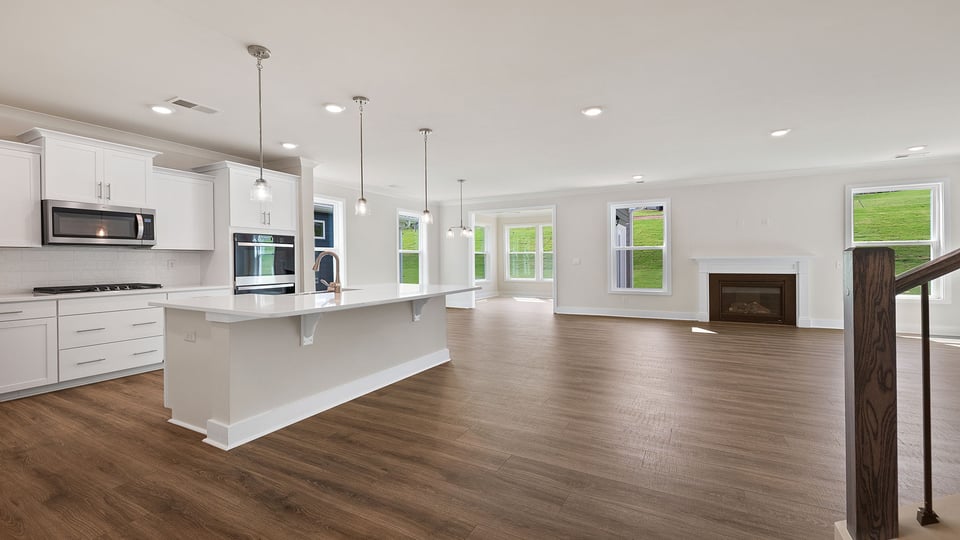 Kitchen with island and cabinet.