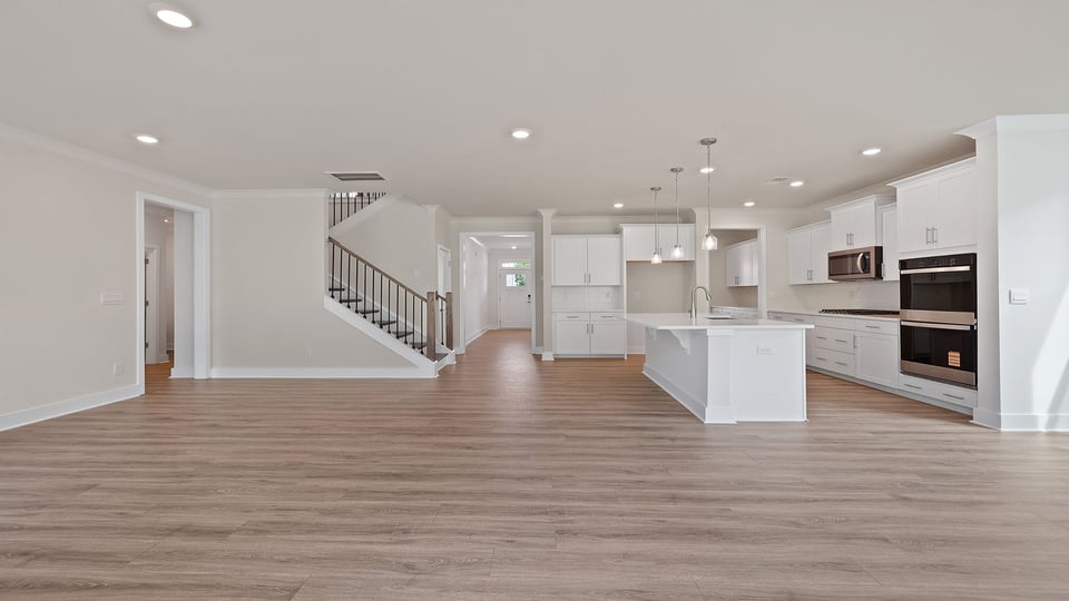 Living area with fireplace and windows.