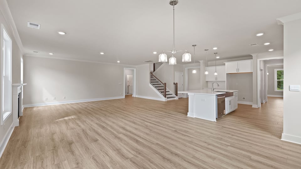 Living area with fireplace and windows.