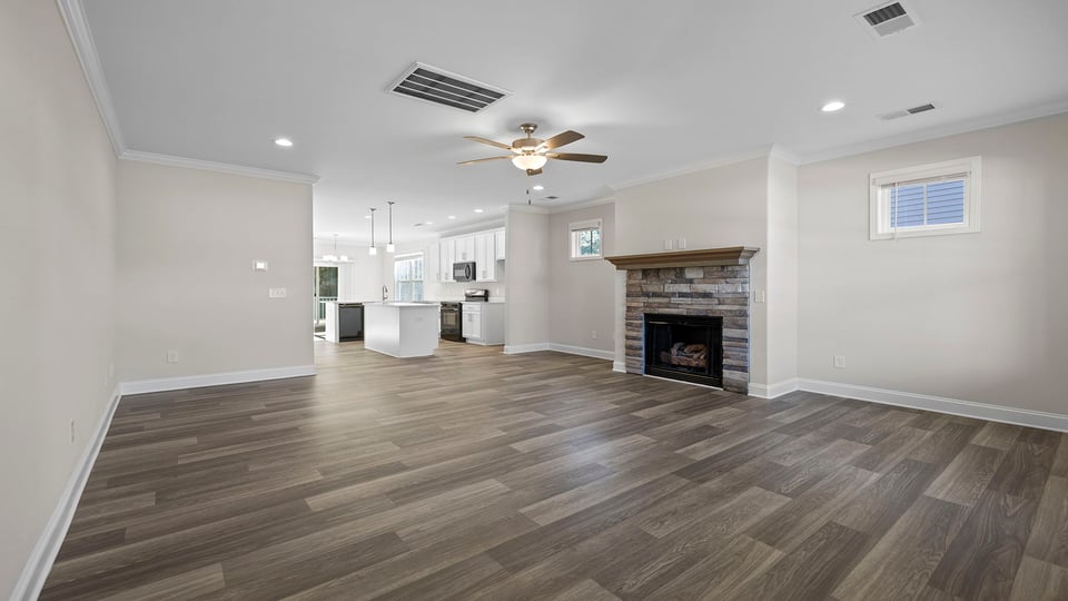 Living area with gas log fireplace.