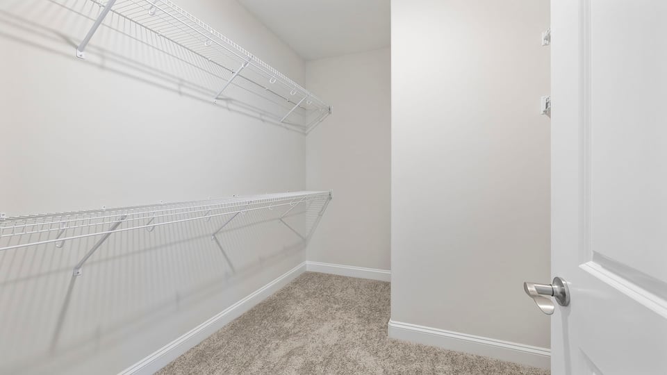 Primary bedroom walk-in closet.