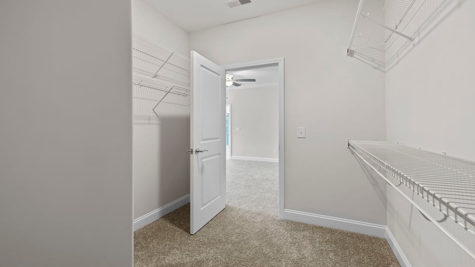 Primary bedroom walk-in closet.