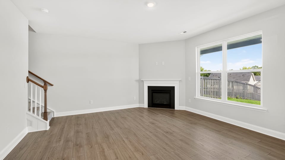 Family room with window and fireplace.