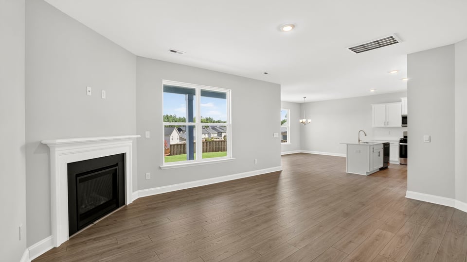 Family room with window and fireplace.