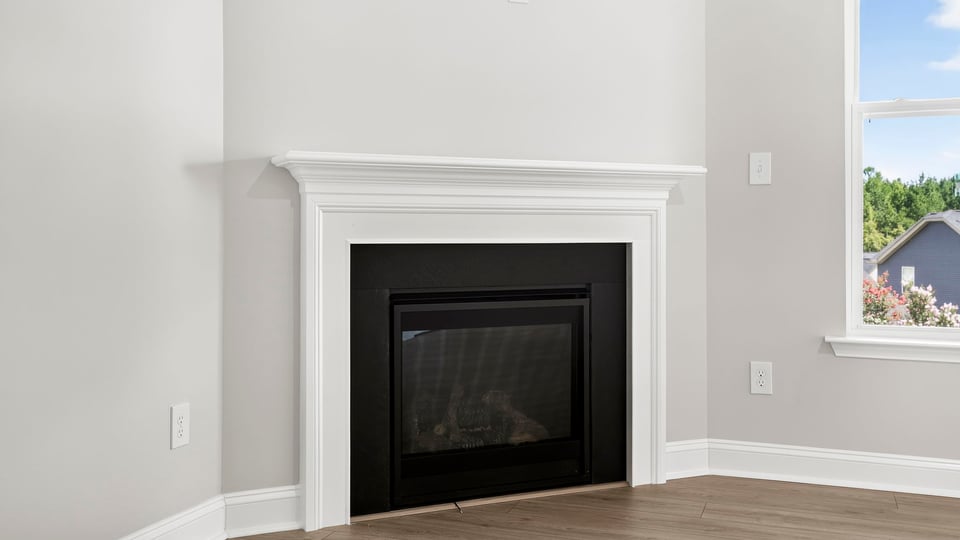 Family room with window and fireplace.