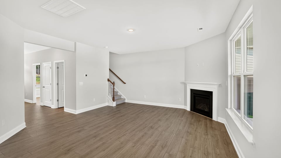Family room with window and fireplace.