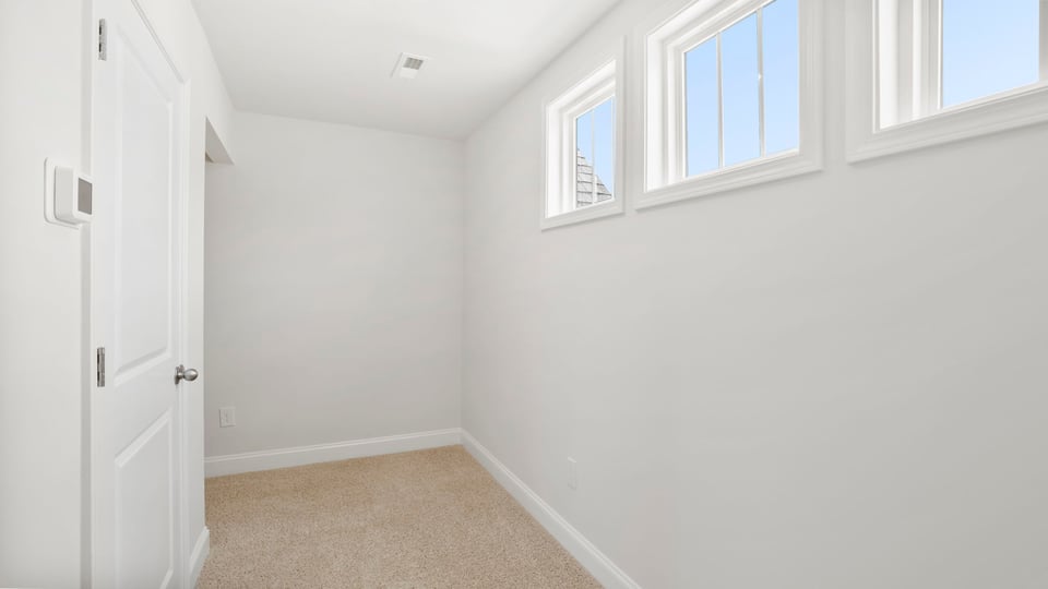 Hallway upstairs with windows.