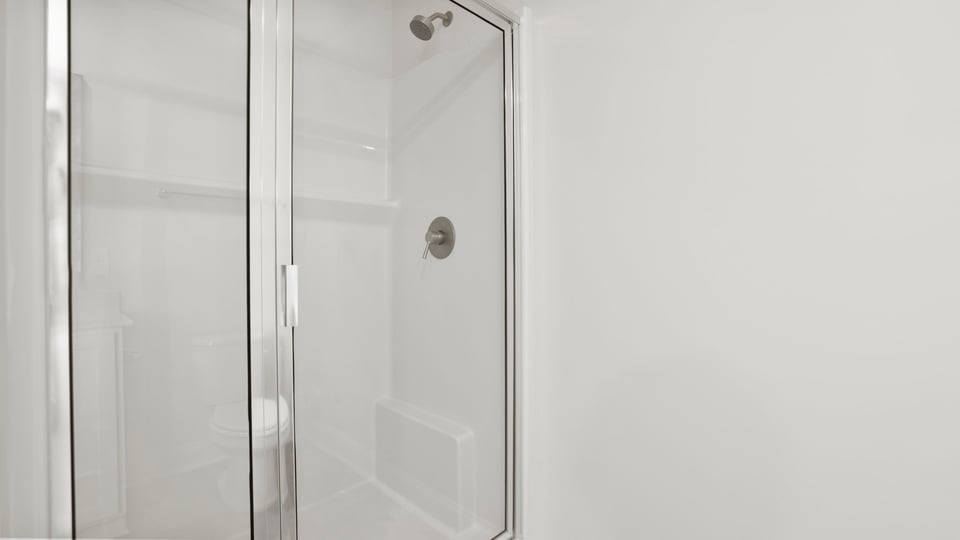 Bathroom with walk in shower.