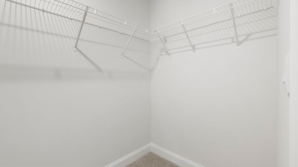 Closet with hanging storage racks.