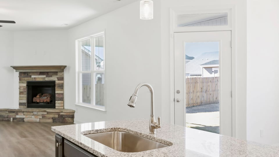 Kitchen with island and cabinets.