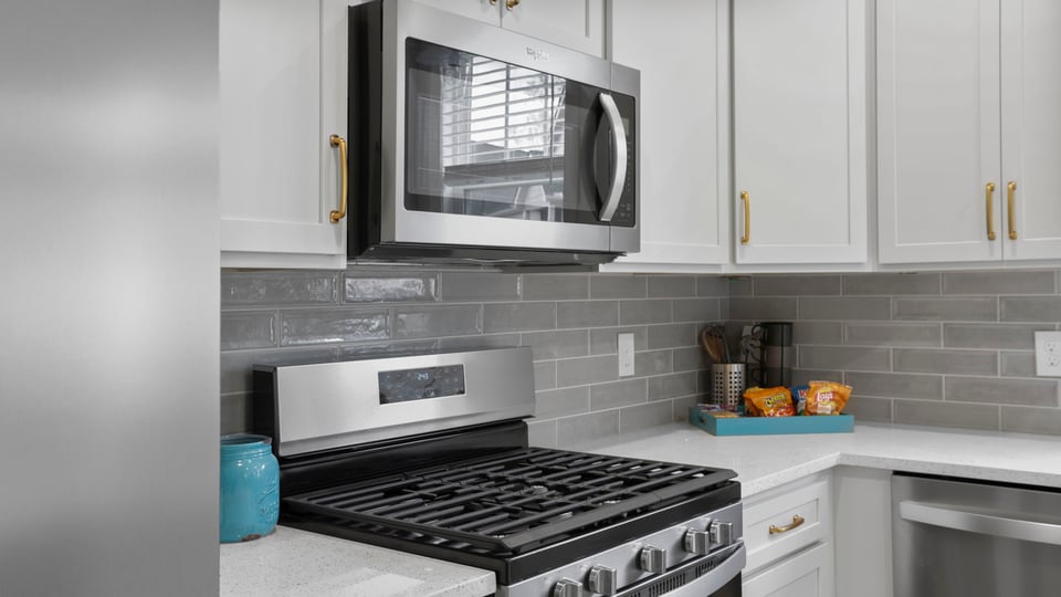 Kitchen with island and cabinets.ac