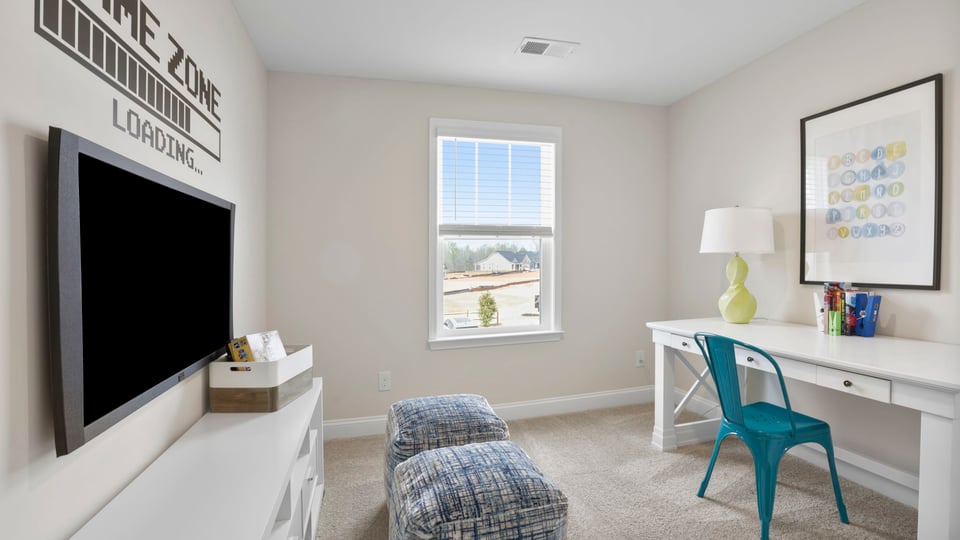 Bedroom with carpet and window.