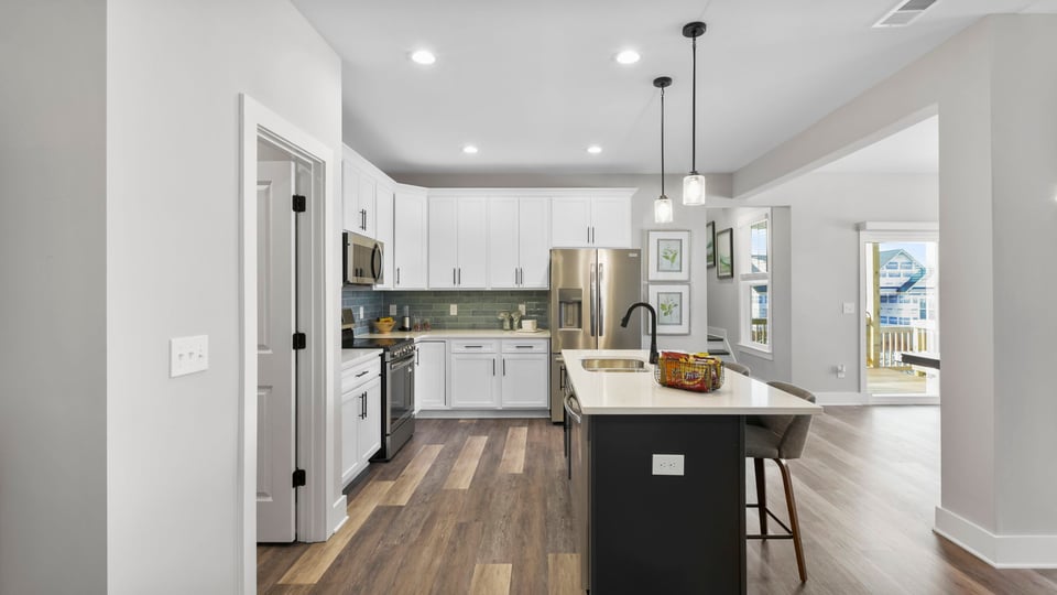 Kitchen with island and cabinets.