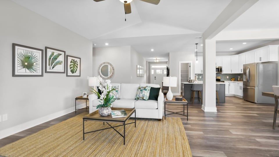 Living room with fireplace and windows.