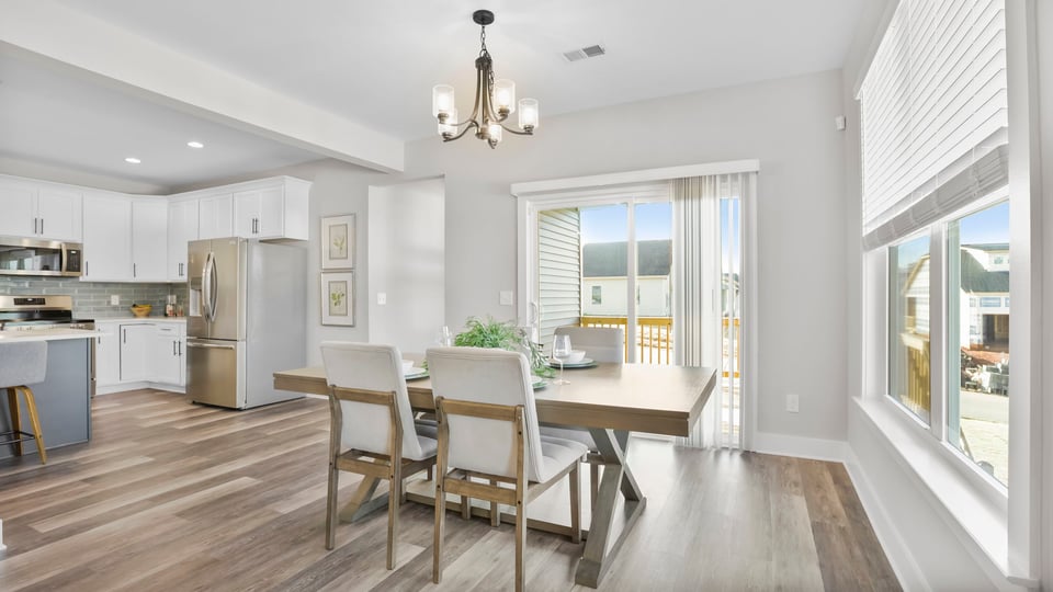 Living room with fireplace and windows.