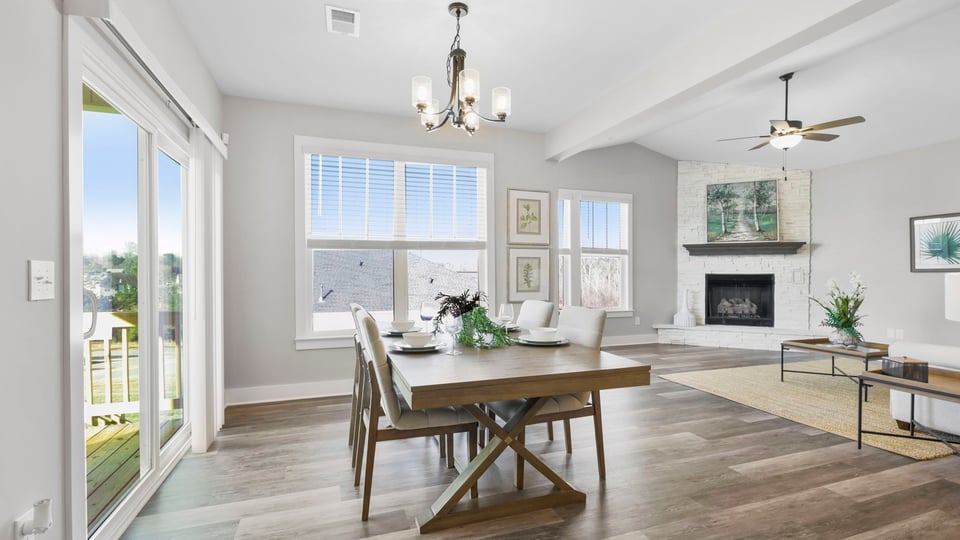 Living room with fireplace and windows.