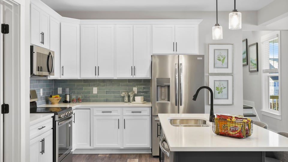 Kitchen with island and cabinets.