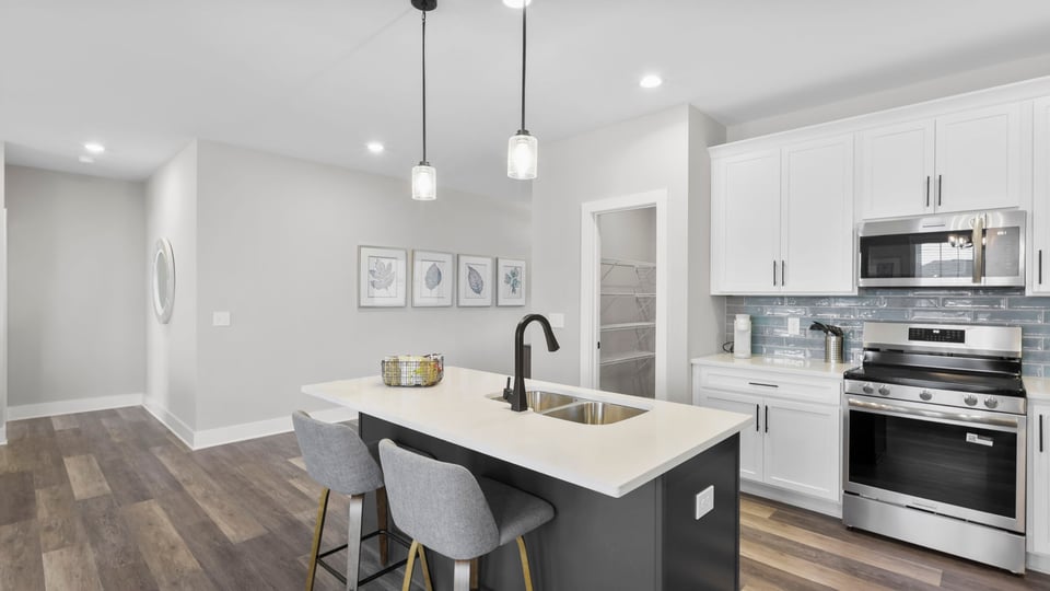 Kitchen with island and cabinets.