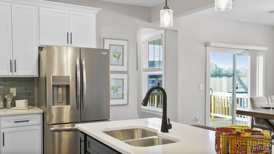 Kitchen with island and cabinets.