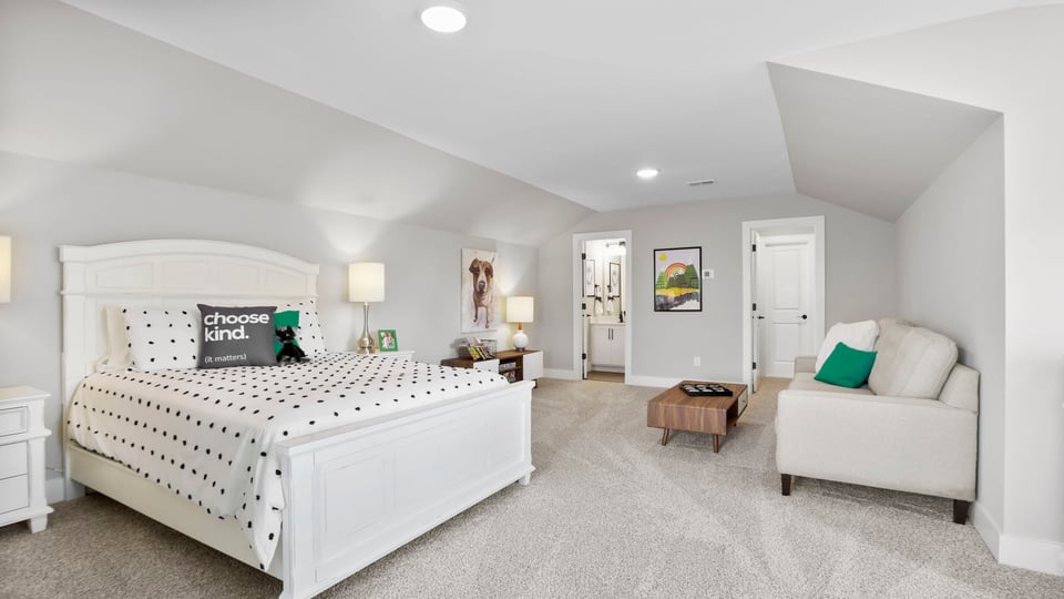 Bonus room with carpet and windows.