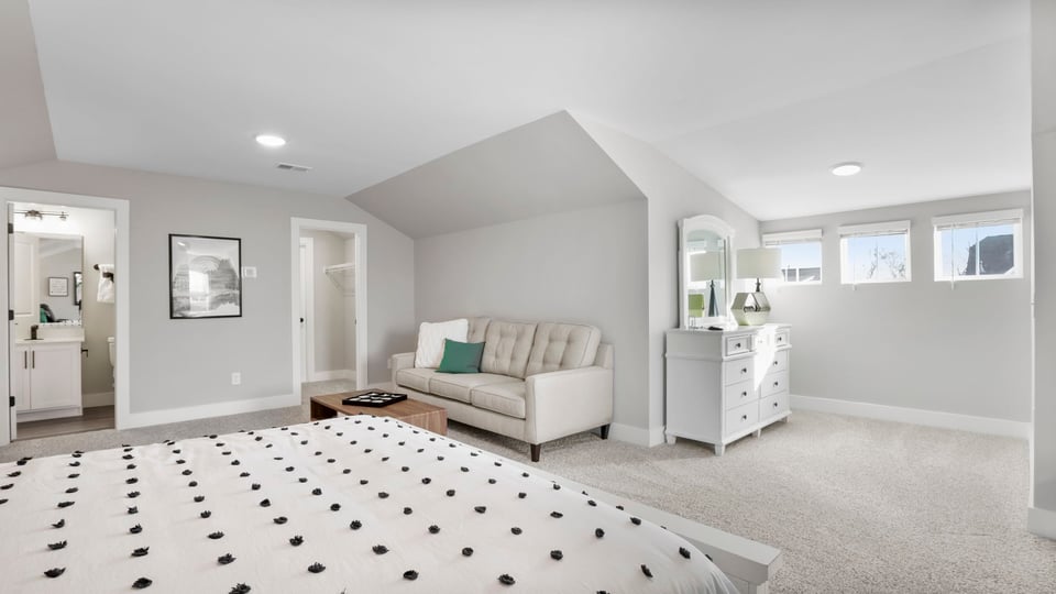 Bonus room with carpet and windows.