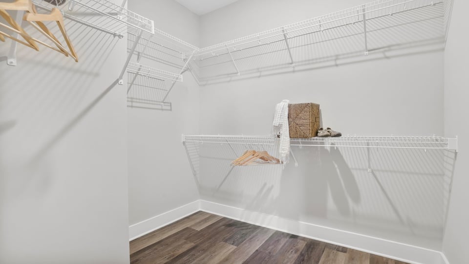 Primary closet with shelf.