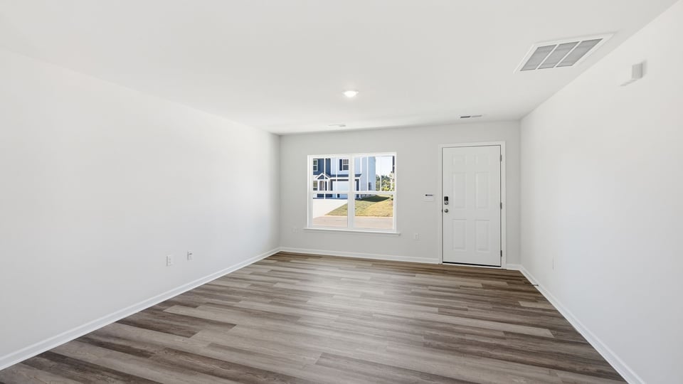 Foyer and living room of home.