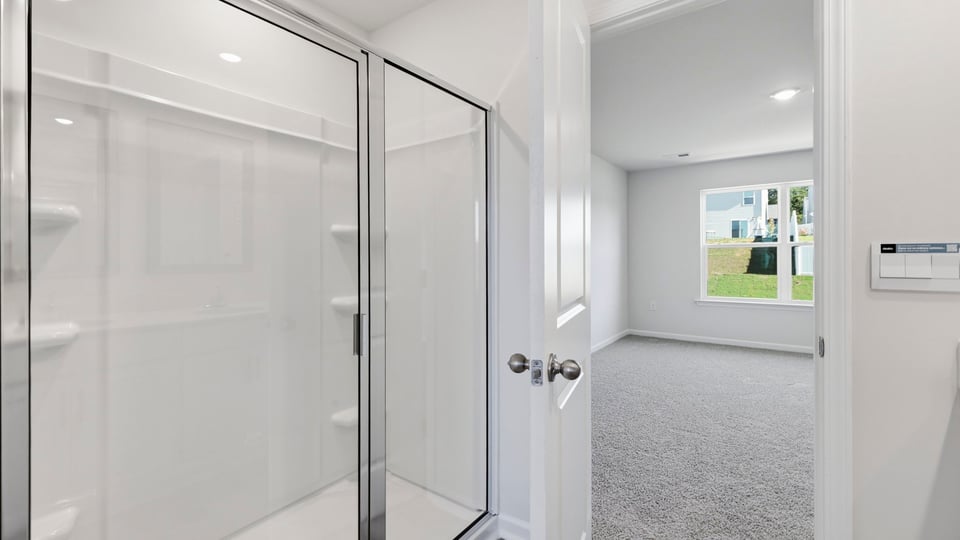 Bathroom with walk in shower.