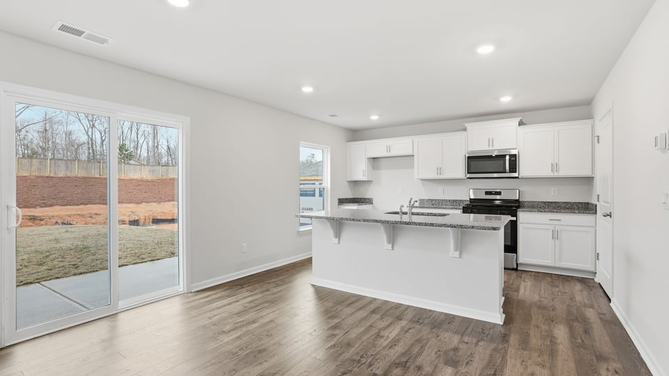 Kitchen with island and windows.