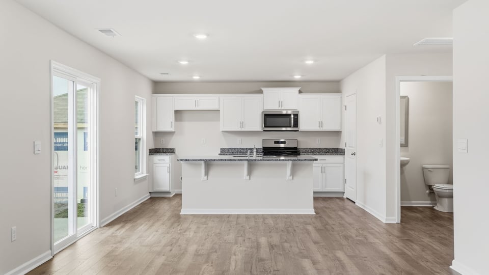 Kitchen with island and windows.