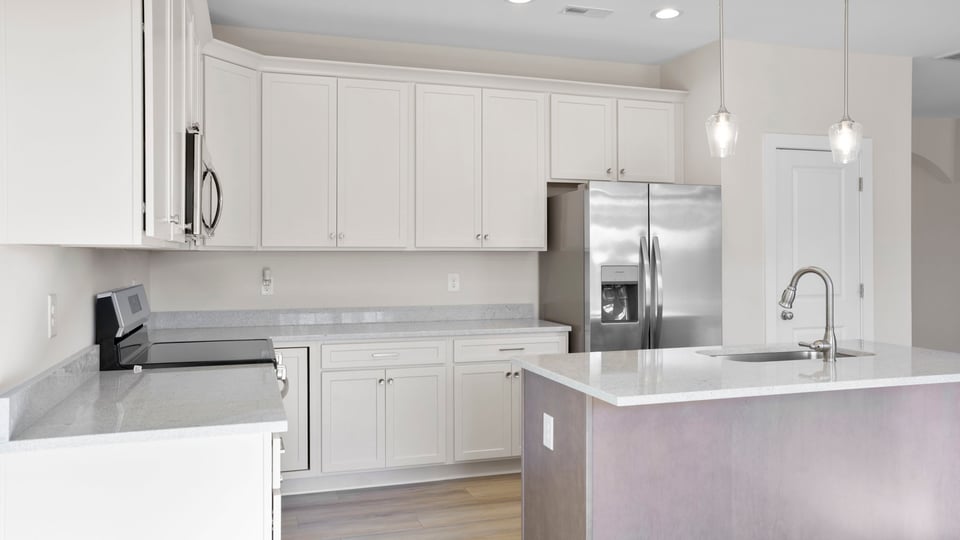 Kitchen and island with granite countertops.
