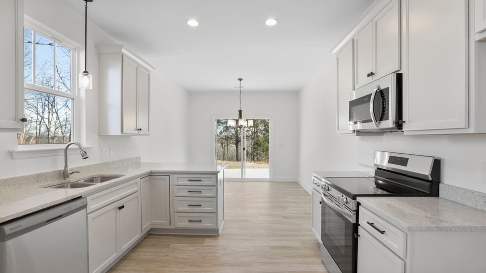 Kitchen with granite countertops and stainless steel appliances.