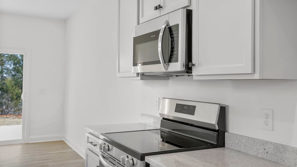 Kitchen with granite countertops and stainless steel appliances.