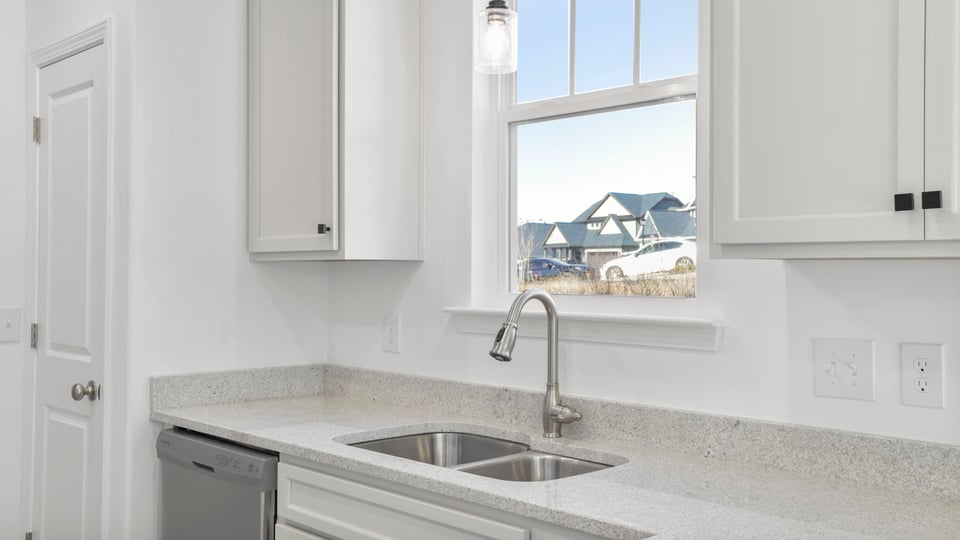 Kitchen with granite countertops and stainless steel appliances.