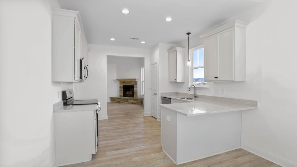 Kitchen with granite countertops and stainless steel appliances.