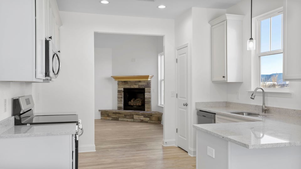 Kitchen with granite countertops and stainless steel appliances.