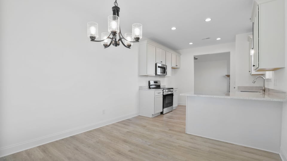 Dining room with chandelier.