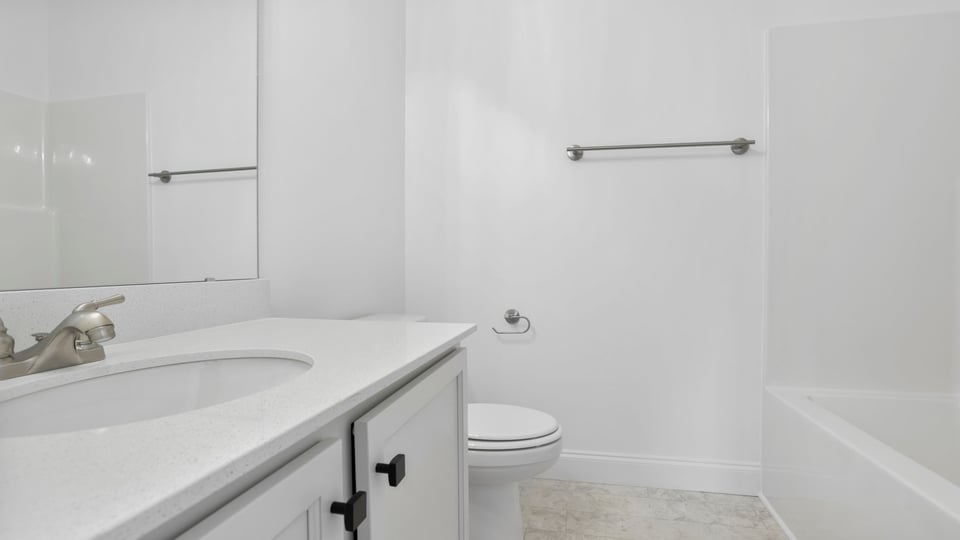 Bathroom with vanity and tub.