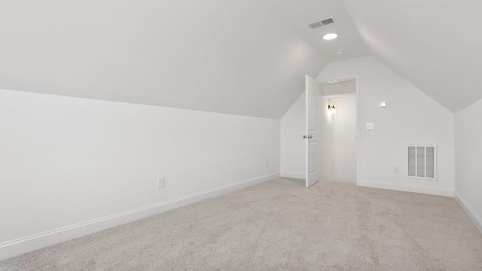 Bonus room with carpet.