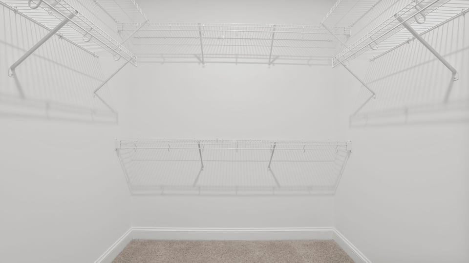 Walk in closet with shelves.