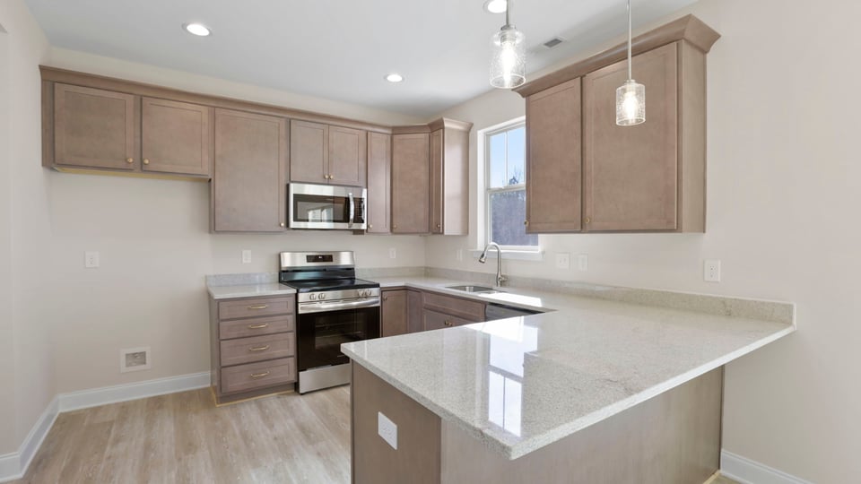 Kitchen with granite countertops and stainless steel appliances.