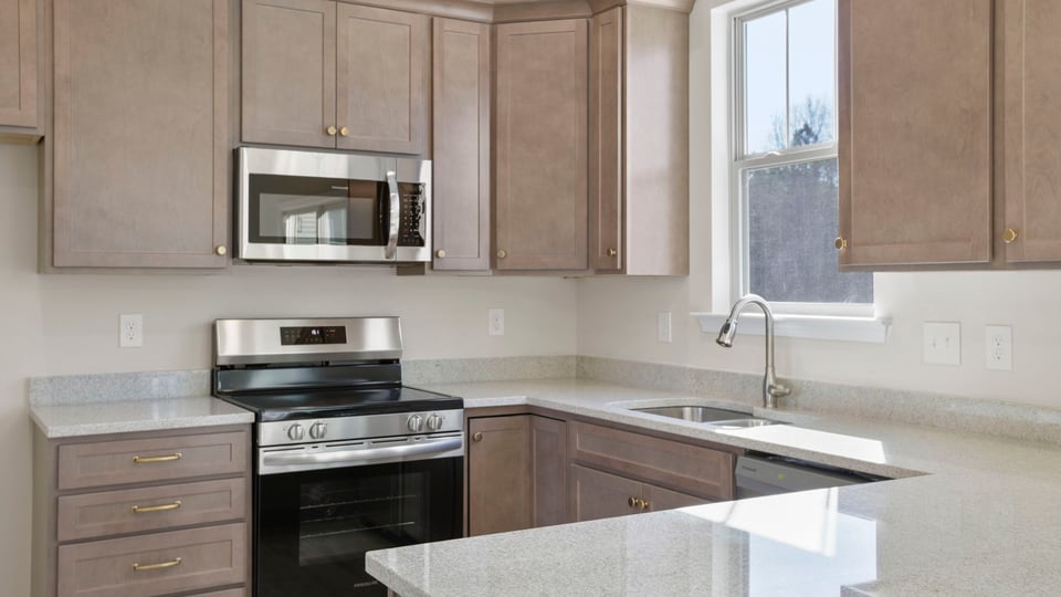 Kitchen with granite countertops and stainless steel appliances.