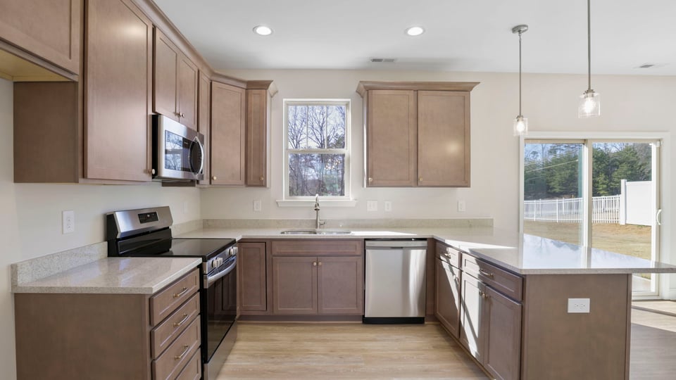 Kitchen with granite countertops and stainless steel appliances.